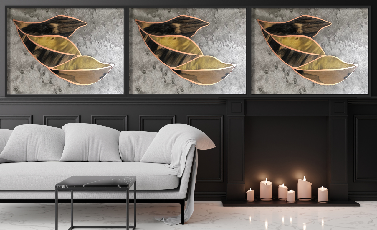Triptyque mural en marqueterie cloisonnée, associant bois et cuivre avec des motifs de feuilles stylisées. Ces créations contemporaines mettent en valeur un savoir-faire artisanal unique, idéal pour sublimer un intérieur moderne.